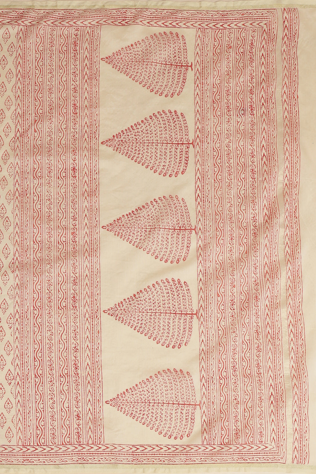 Macro close-up shot focusing on the intricate artisanal red block patterns and fine mercerized weave