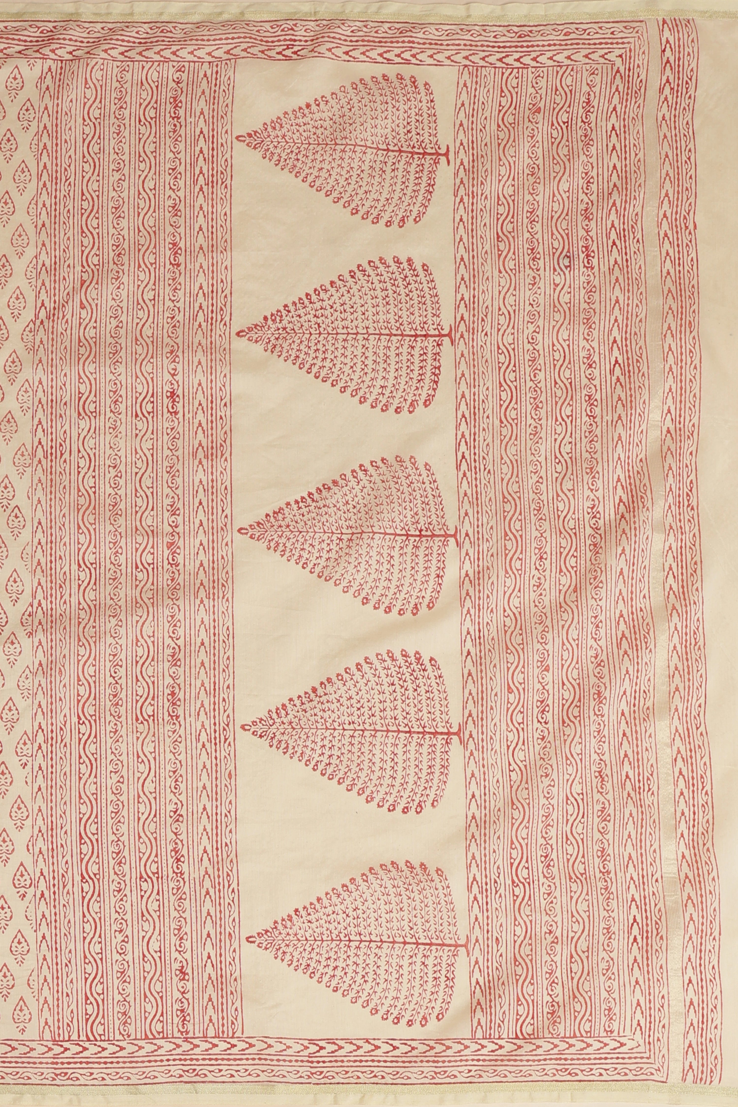 Macro close-up shot focusing on the intricate artisanal red block patterns and fine mercerized weave