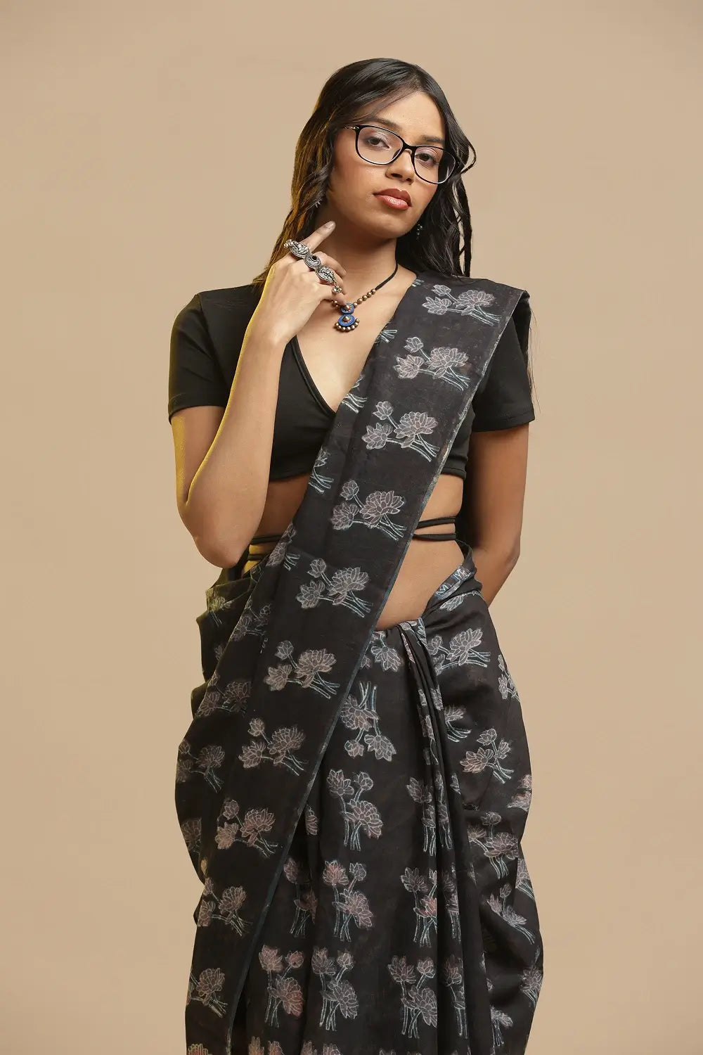 Full length view of the black Bagru hand-block print cotton saree showcasing the traditional drape and styling