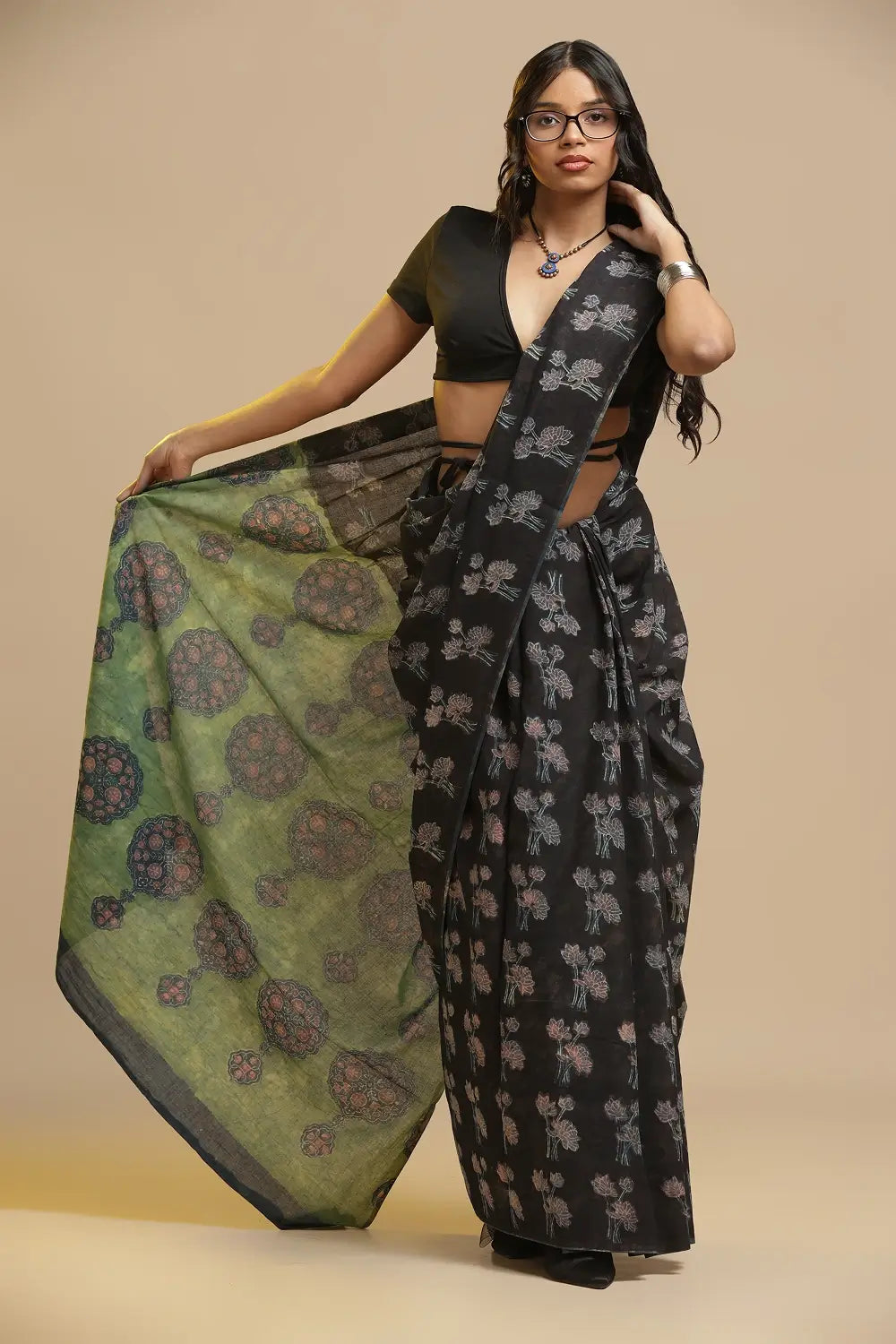 Black Lotus black and green hand-block Bagru cotton saree with striking olive green pallu displayed by a model