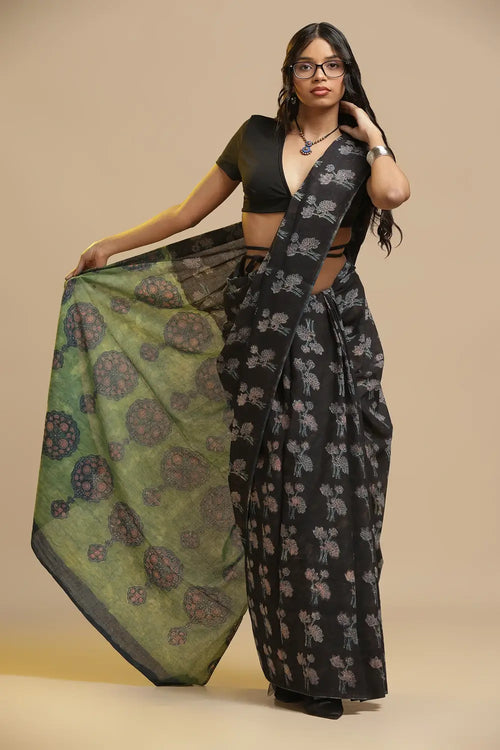 Black Lotus black and green hand-block Bagru cotton saree with striking olive green pallu displayed by a model