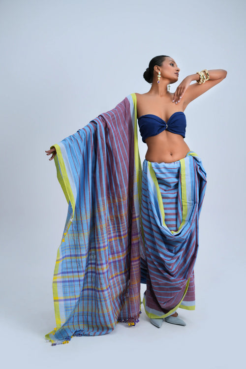 Full-length front view of a model wearing the sky blue and mauve striped organic Kala cotton Bhujodi saree featuring a lime-yellow border and check pallu