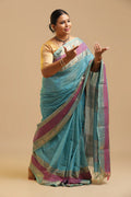 Celestial Charm pastel blue Kanchipuram handloom cotton saree with Kalaimagal motif pallu displayed by a dancer in a classical pose