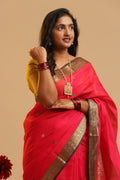 Corner Butta Kanchipuram handloom silk cotton saree in vibrant red with traditional dark border displayed by a model