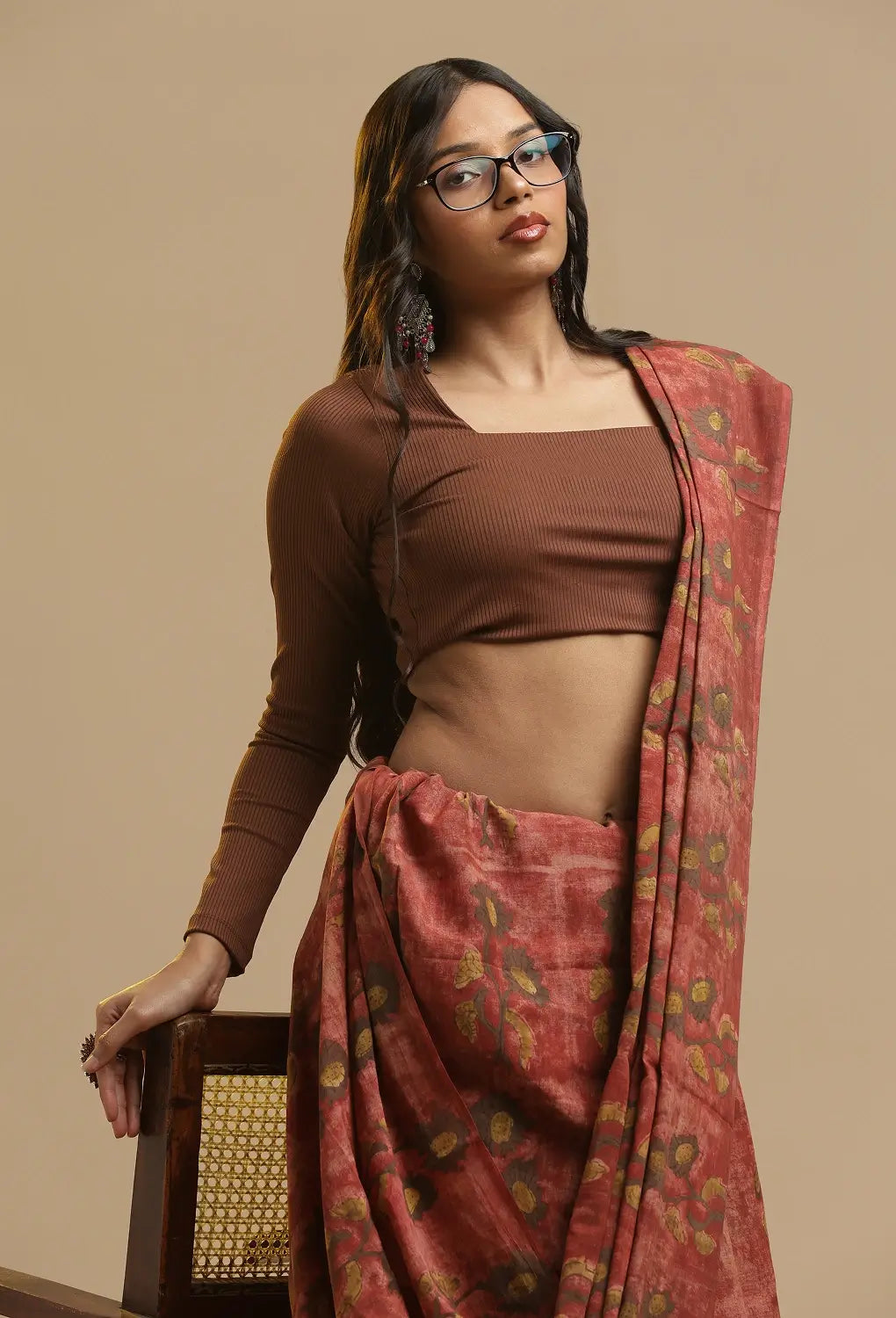Full length view of the red Bagru hand-block print cotton saree showing the traditional drape and styling