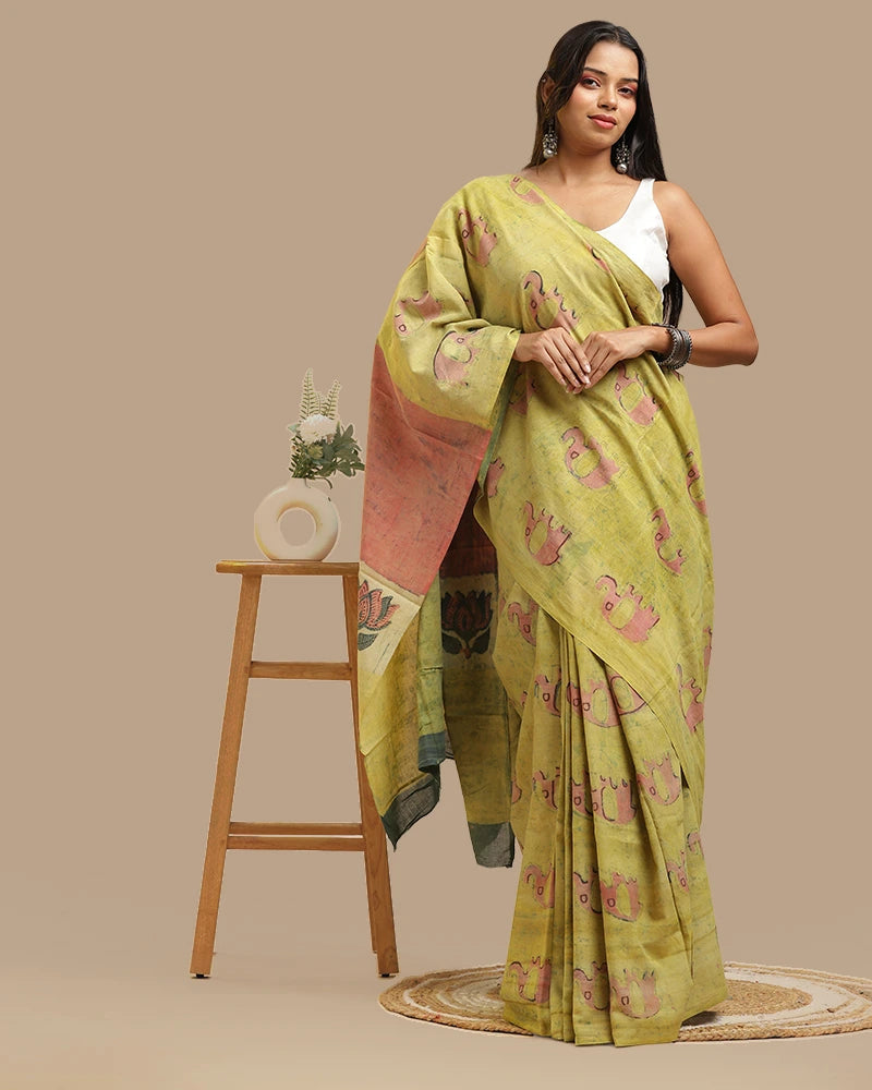 Full length view of the moss green Bagru handblock print cotton saree showing the traditional drape and styling