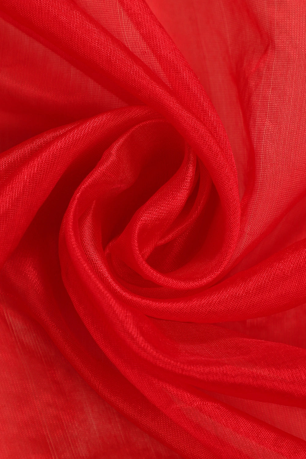 Close-up view of the smooth red pattu silk fabric highlighting its lustrous texture and fine handwoven finish