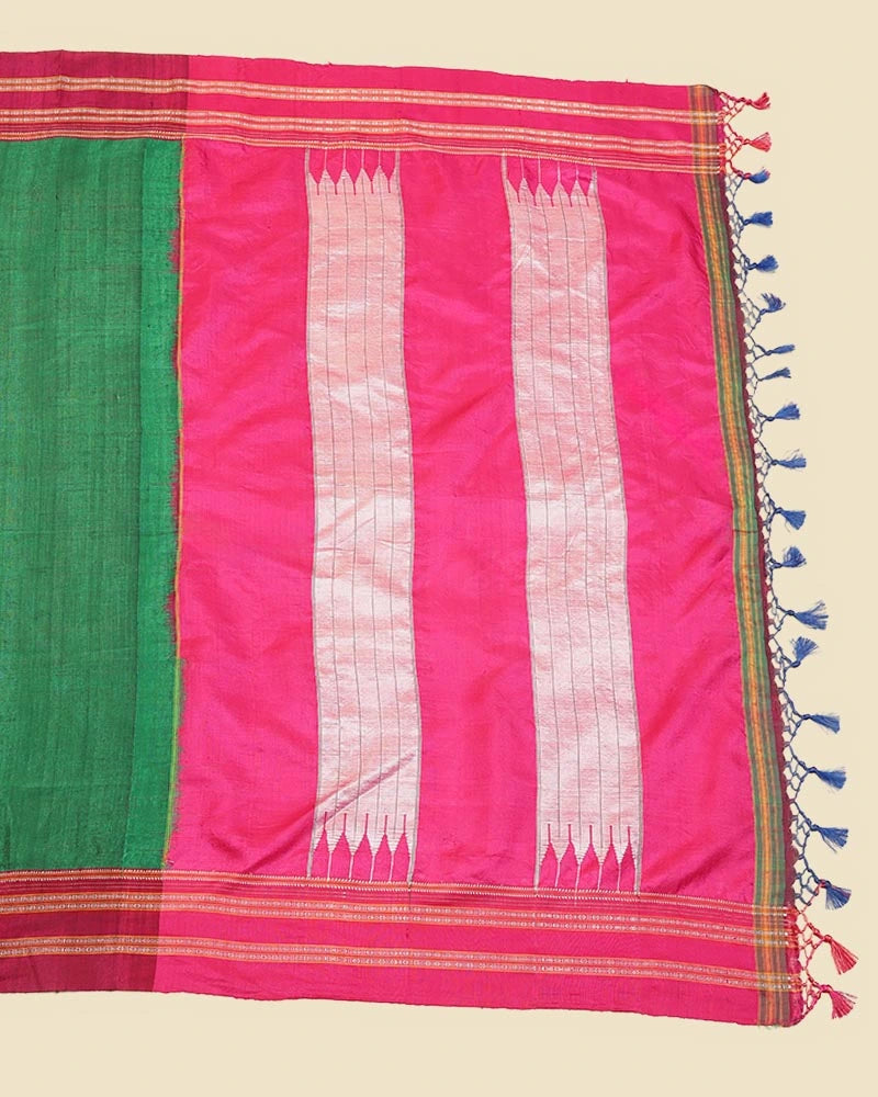 Flat-lay studio arrangement showcasing the signature Tope-Teni loop-join pure silk pallu with traditional pink-and-green striped motifs