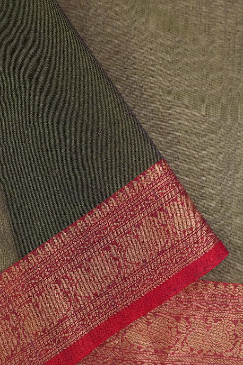 Close-up view of the rich contrasting border and two-tone texture of the Emerald Elegance saree