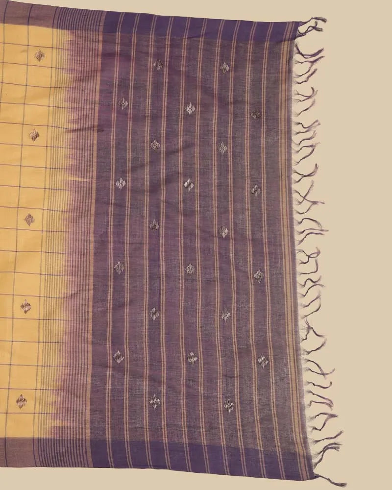 Detailed close-up of the striking royal purple pallu featuring woven stripes, buti details, and hand-tied tassel fringe