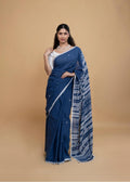 Full-length view of a model wearing the deep indigo blue organic Kala cotton Bhujodi saree with clean ivory-grey borders