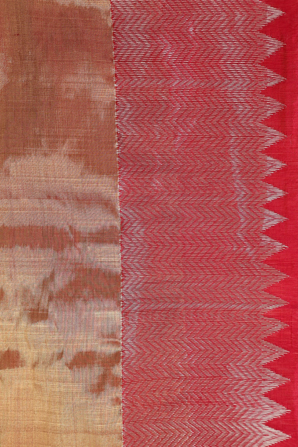 Flat-lay studio arrangement showcasing the contrast border weave and fine zari patterns of the bright red Chanderi pattu silk saree