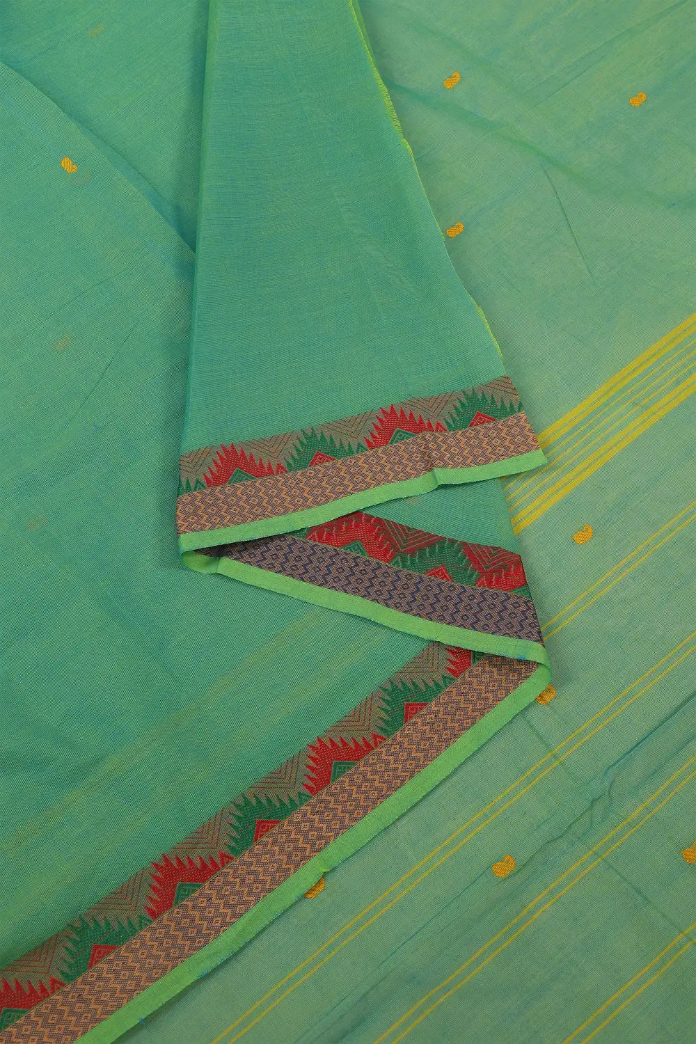 Folded view highlighting the breathable powerloom cotton texture and scattered self-motifs