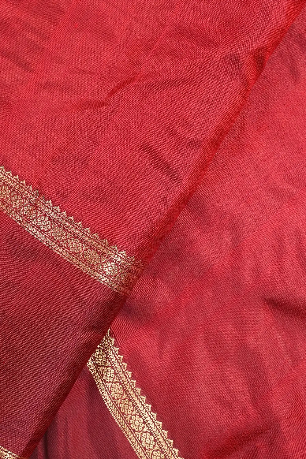 Close-up view of the lustrous pure mulberry silk texture and rich maroon dye