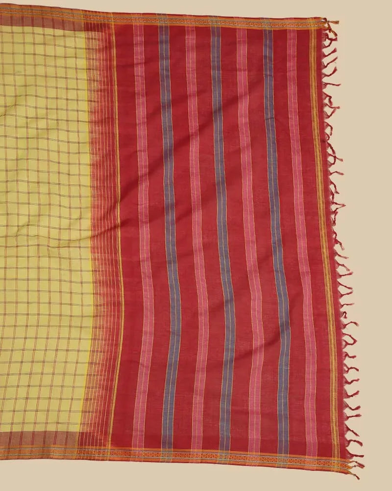 Detailed close-up of the rich maroon pallu featuring traditional woven checks, fine stripes, and hand-tied tassel fringe
