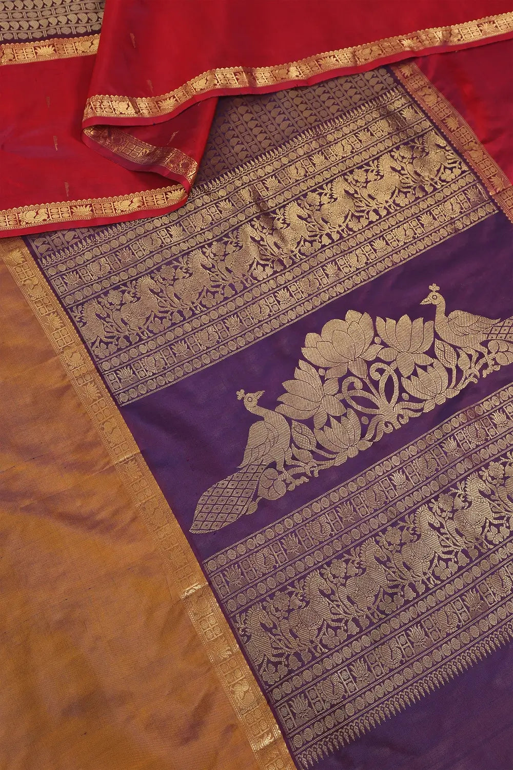 Detailed view of the woven mango motifs and intricate pallu design on the Kanchipuram silk saree