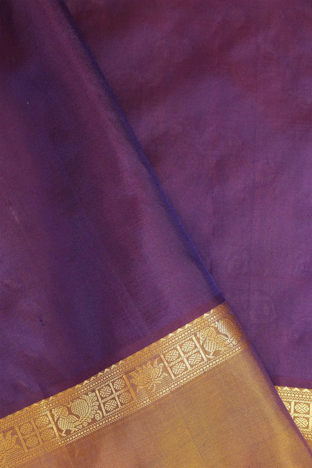 Close-up view of the pure mulberry silk texture and rich color blend of the saree body