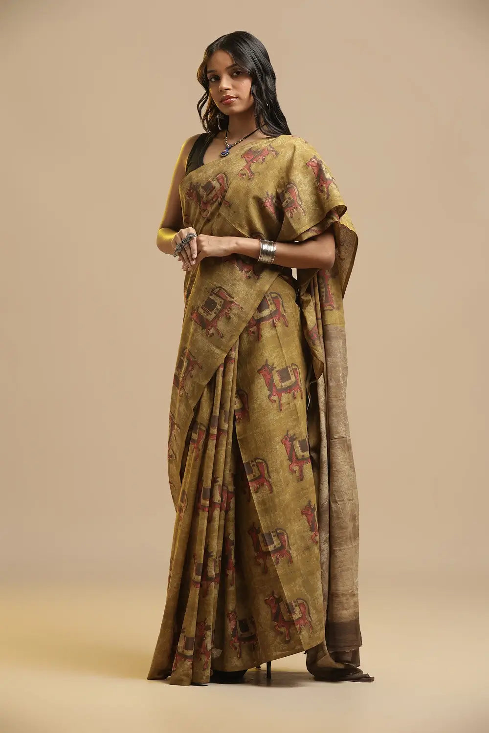 Full length view of the mustard yellow Bagru handblock print cotton saree showing the traditional drape and styling