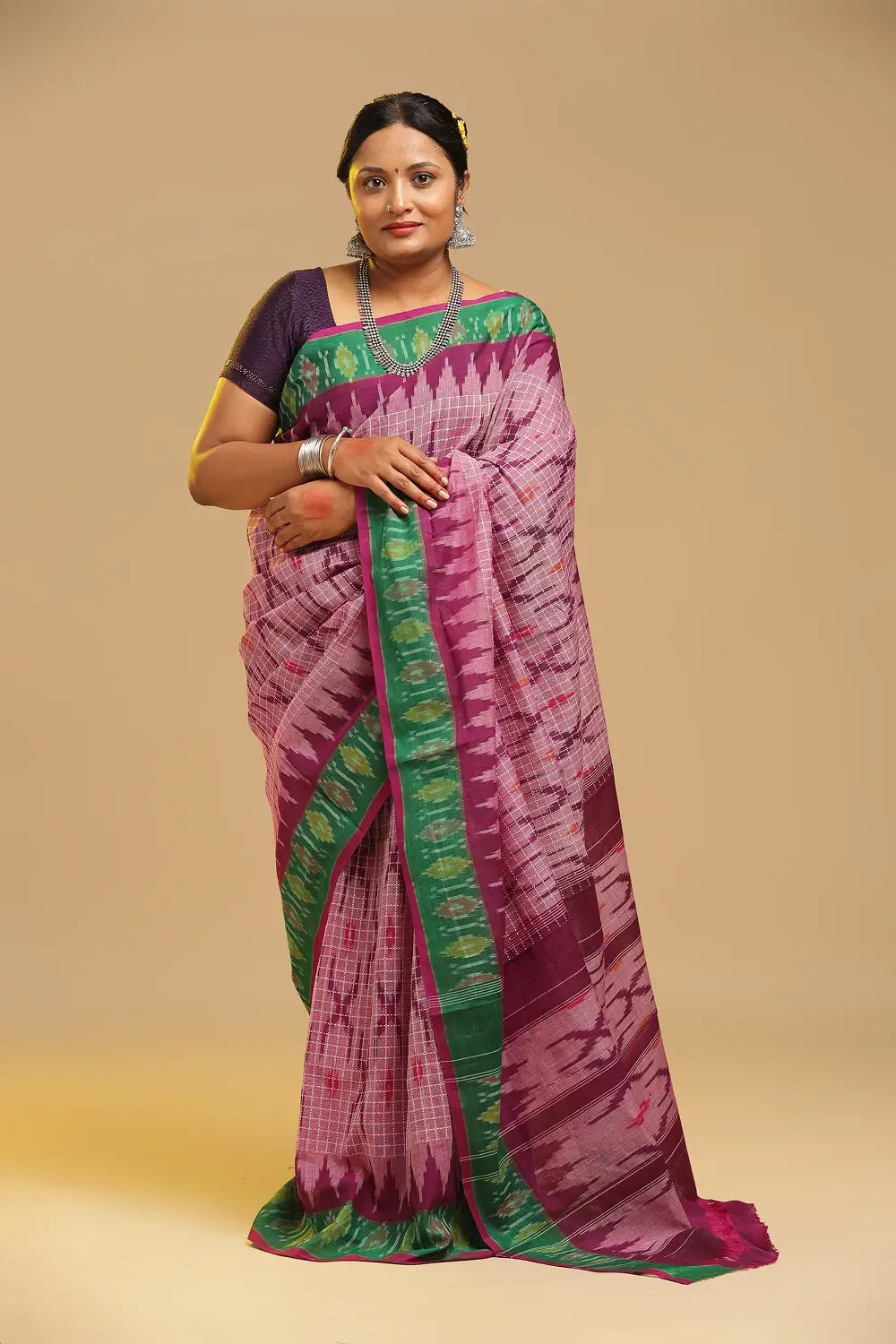 Full view of the pink and green Telangana cotton saree showcasing the traditional drape