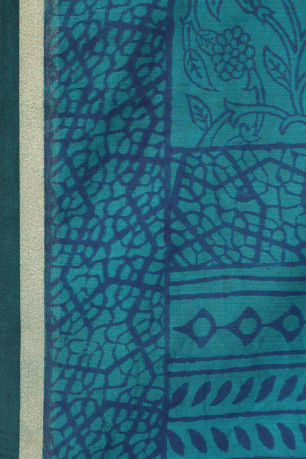 Macro close-up of the mercerized cotton-silk fabric highlighting the fine weave structure, delicate handblock print lines, and shimmering border edge