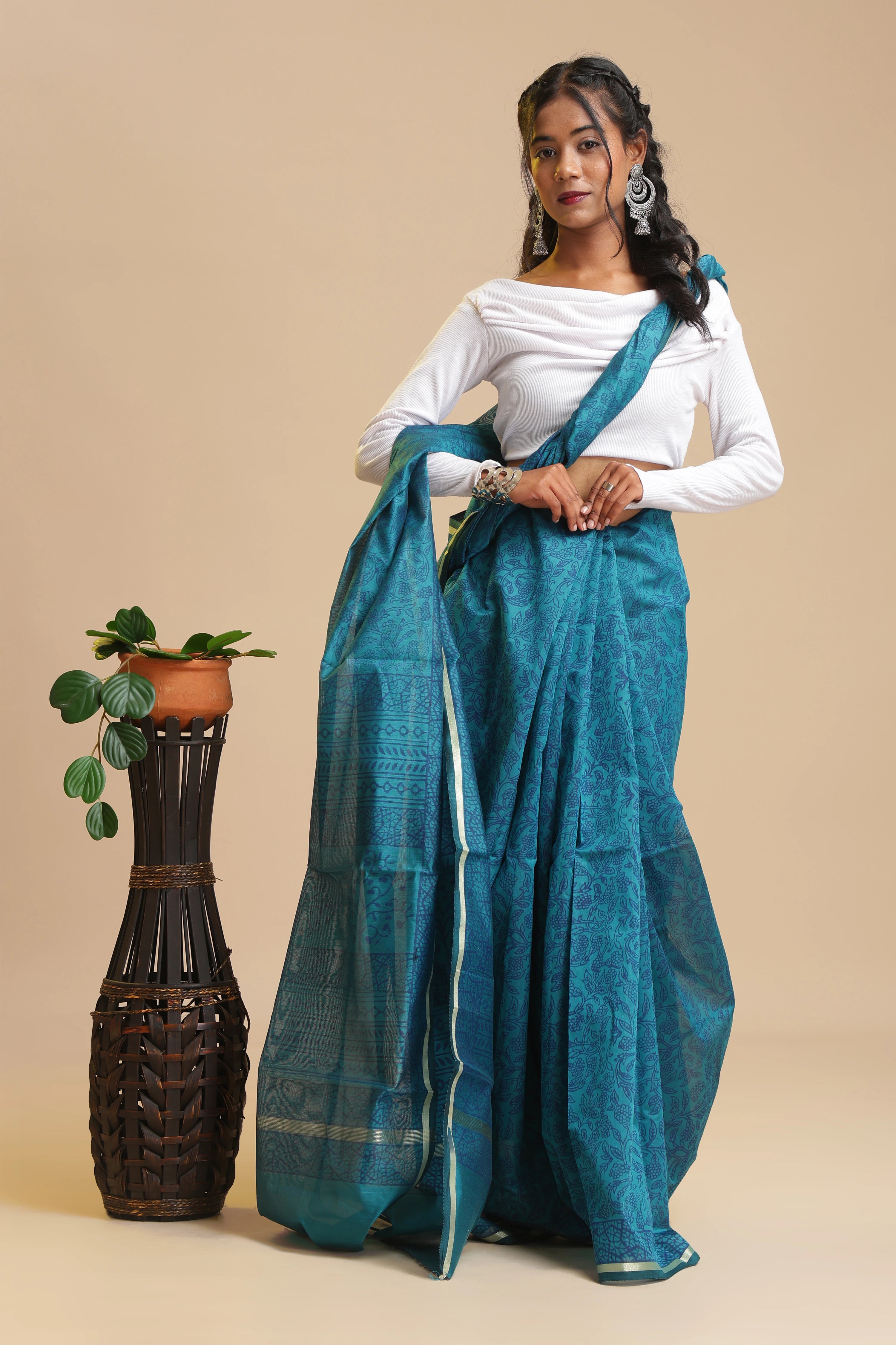 Full-length studio view of a model wearing the marine blue Ocean Whispers Chanderi cotton silk saree featuring handblock printed navy blue motifs and luminous sheen