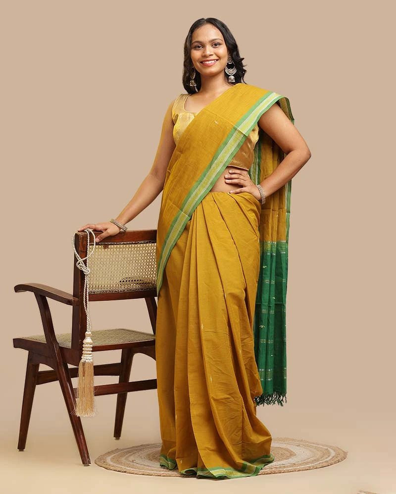 Full length view of the Olive Green Udupi handloom cotton saree showing the traditional drape and contrasting pallu