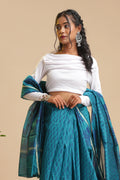 Full-length studio view of a model wearing the peacock blue Peacock Aura Chanderi cotton silk saree featuring handblock printed navy blue motifs and lustrous drape