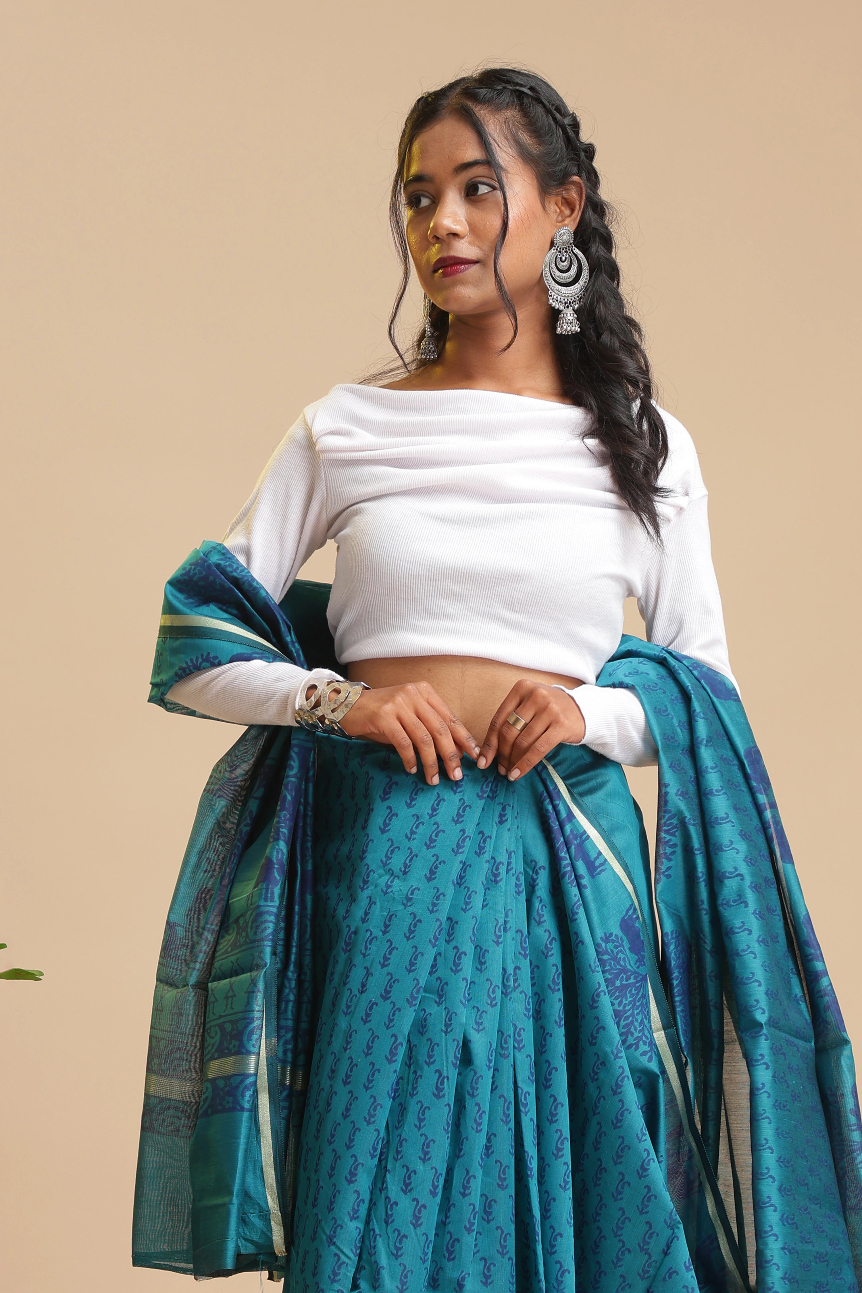 Full-length studio view of a model wearing the peacock blue Peacock Aura Chanderi cotton silk saree featuring handblock printed navy blue motifs and lustrous drape