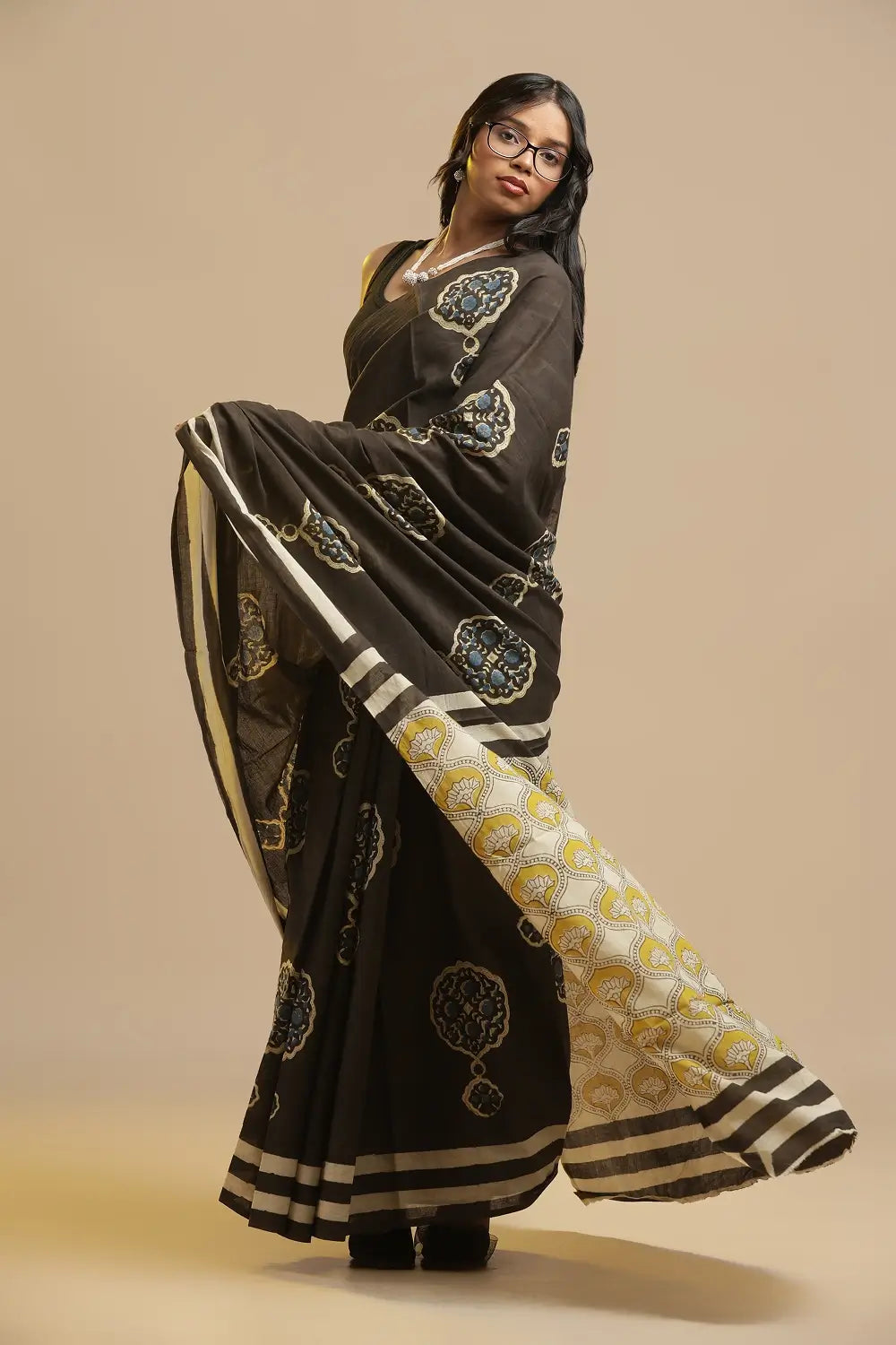 Full length view of the black Bagru handblock print cotton saree showing the traditional drape and styling