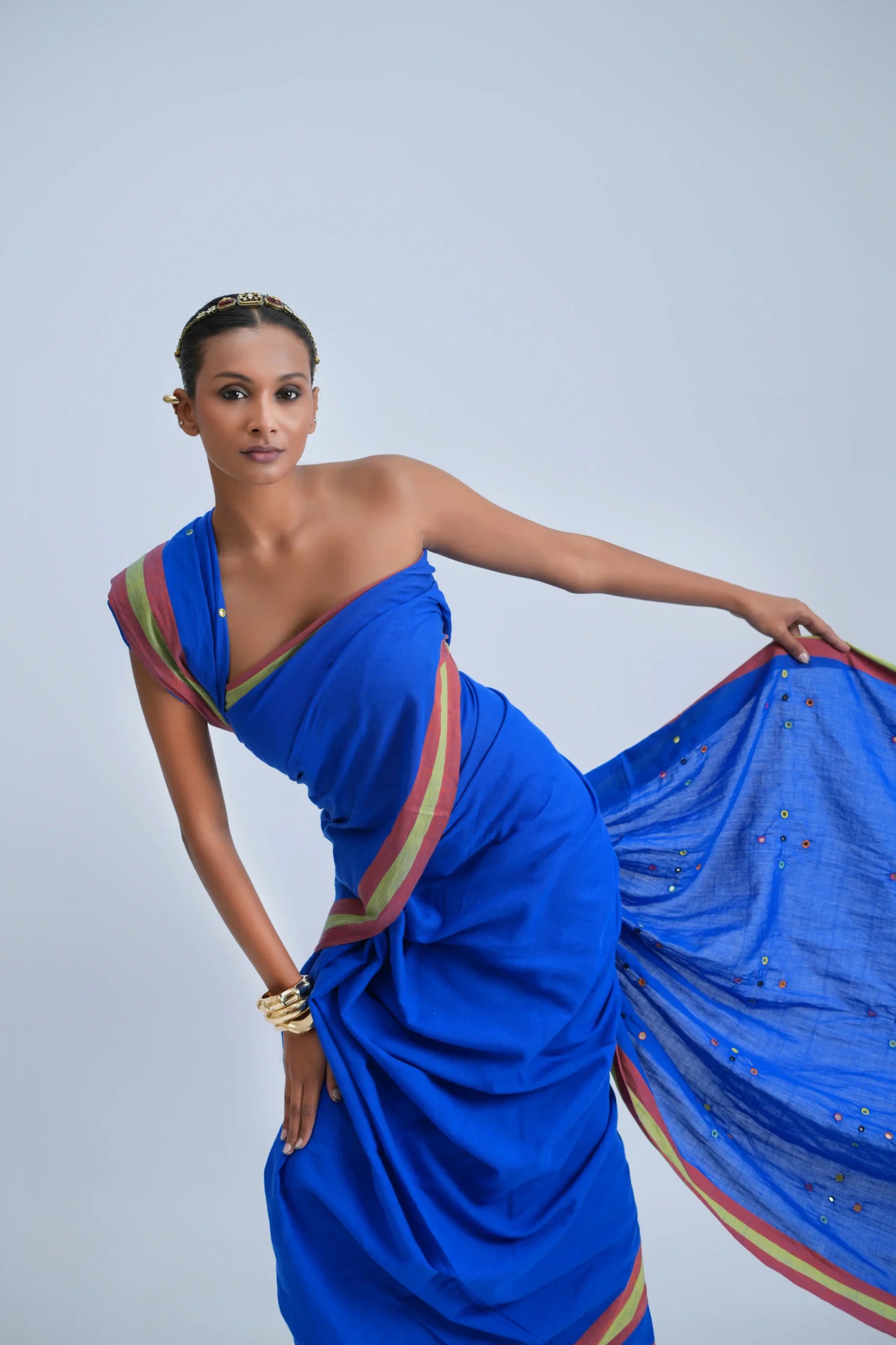 Close-up front view displaying the mirror-embellished royal blue body fabric and double-stripe border alignment