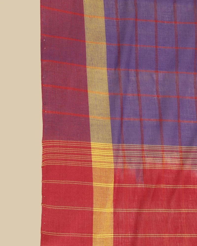 Close-up fabric shot highlighting the royal purple checked weave pattern and the zari-accented border lines