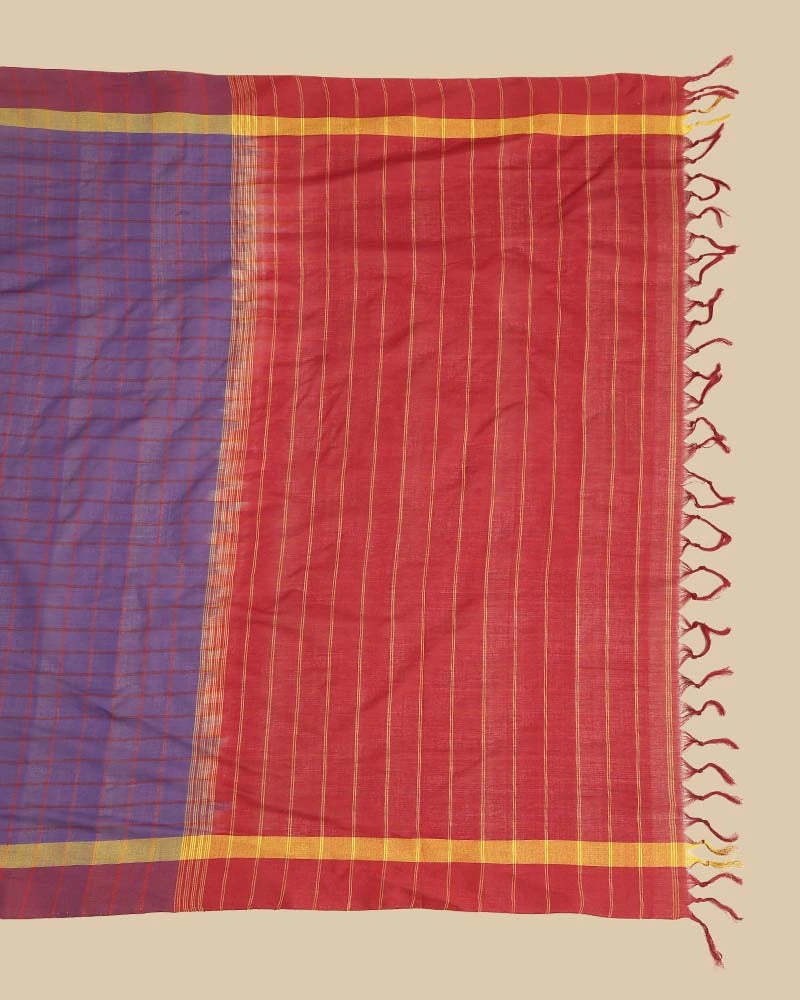 Detailed close-up of the rich maroon pallu featuring woven stripes, zari details, and hand-tied tassel fringe