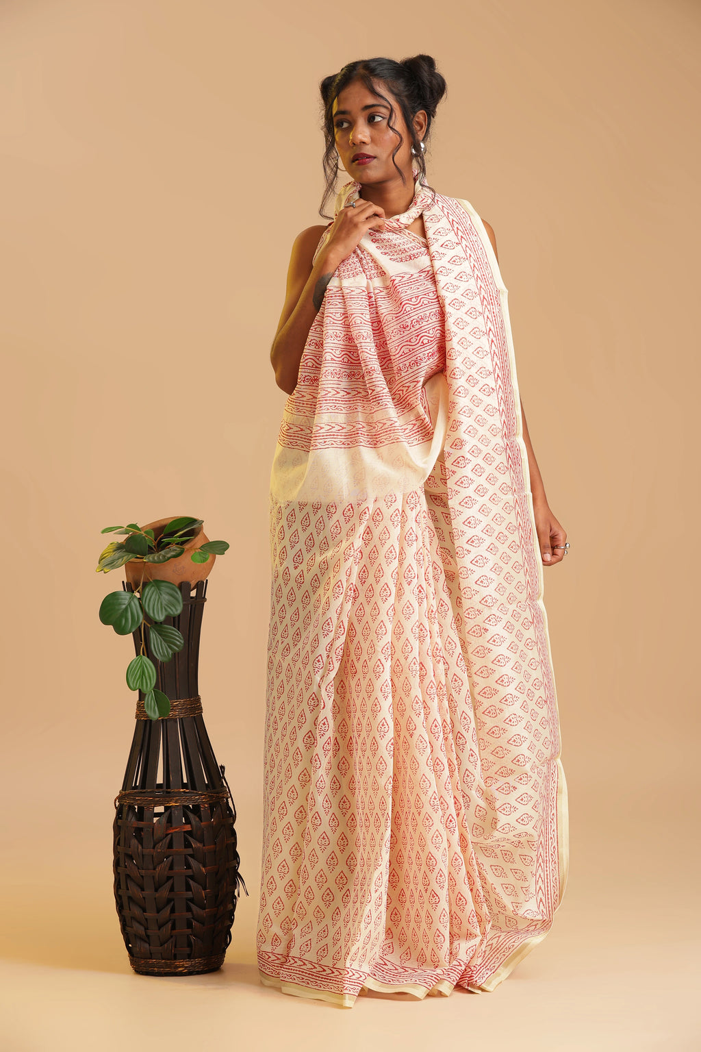 Studio view emphasizing the luminous sheen, breathable texture, and elegant styling of the Sindoor Reverie saree