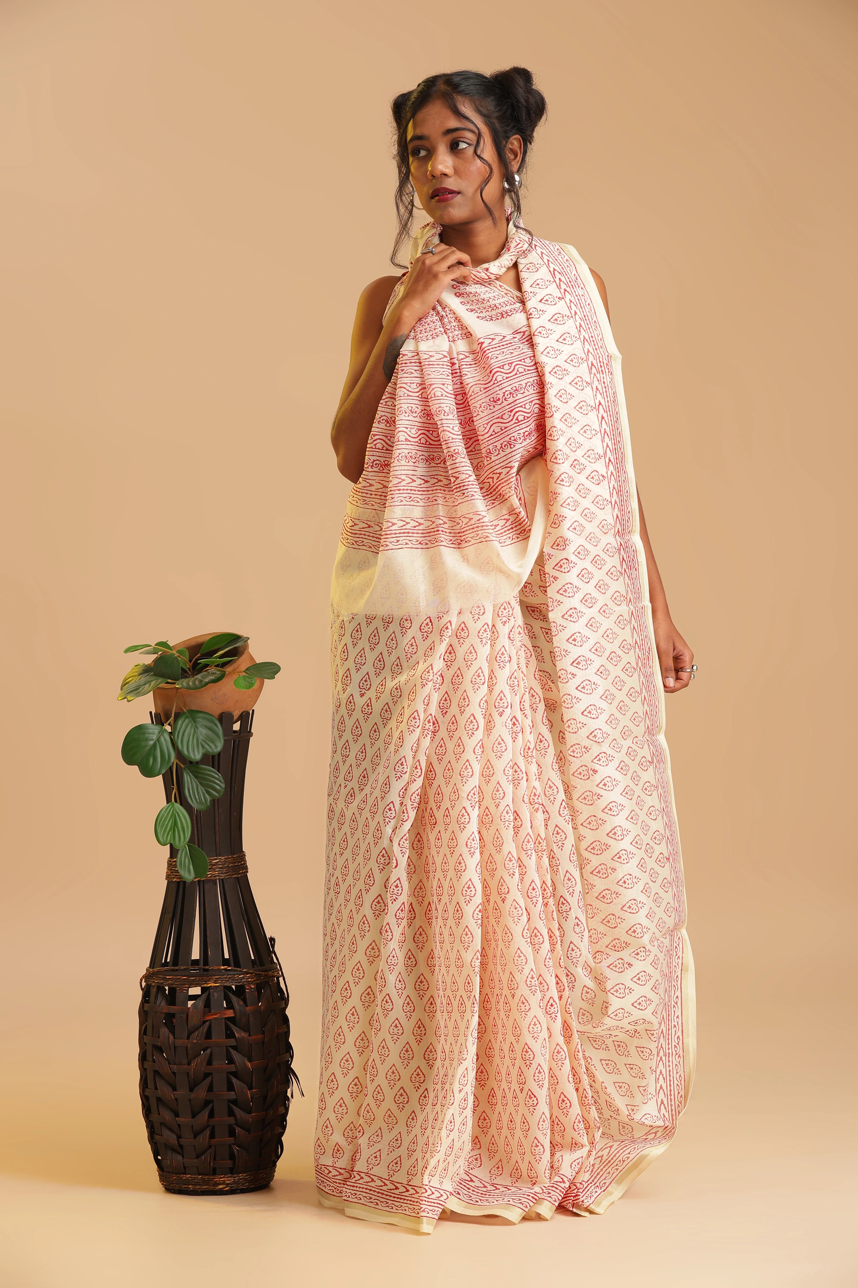 Studio view emphasizing the luminous sheen, breathable texture, and elegant styling of the Sindoor Reverie saree
