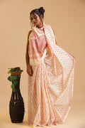 Full-length studio view of a model wearing the ivory Sindoor Reverie Chanderi cotton silk saree featuring rich sindoor-red handblock printed motifs