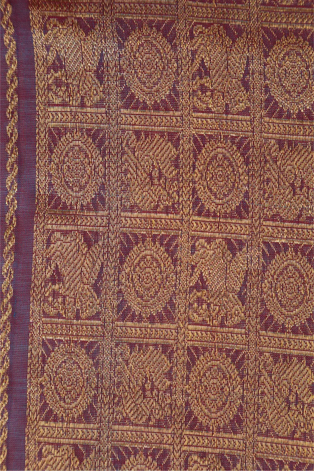 Close-up of the textured check pattern and traditional motifs woven across the lavender saree body