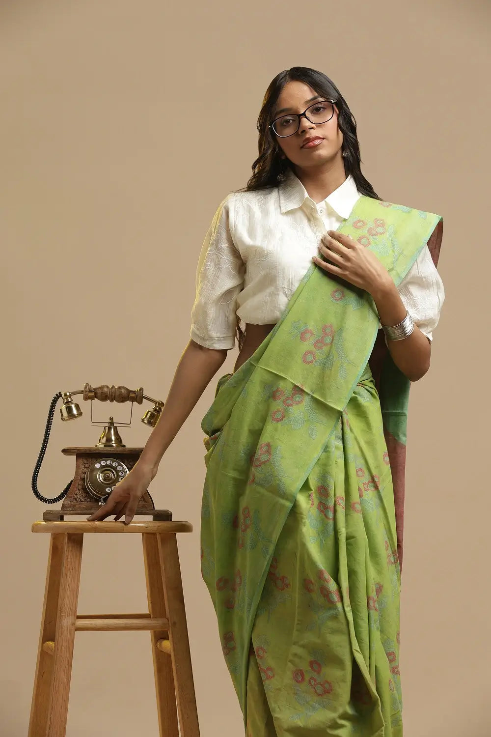 Full length view of the lime green Bagru handblock print cotton saree showing the traditional drape and styling